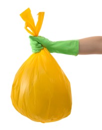 Photo of Woman holding plastic bag full of garbage on white background, closeup