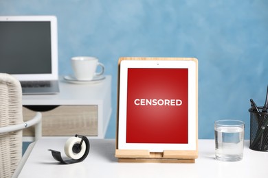 Image of Tablet with censorship sign on white table