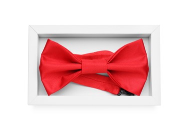 Stylish red bow tie on white background, top view