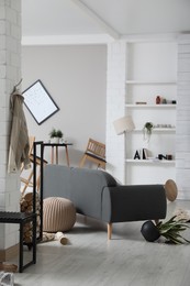 Chaotic living room interior after strong earthquake