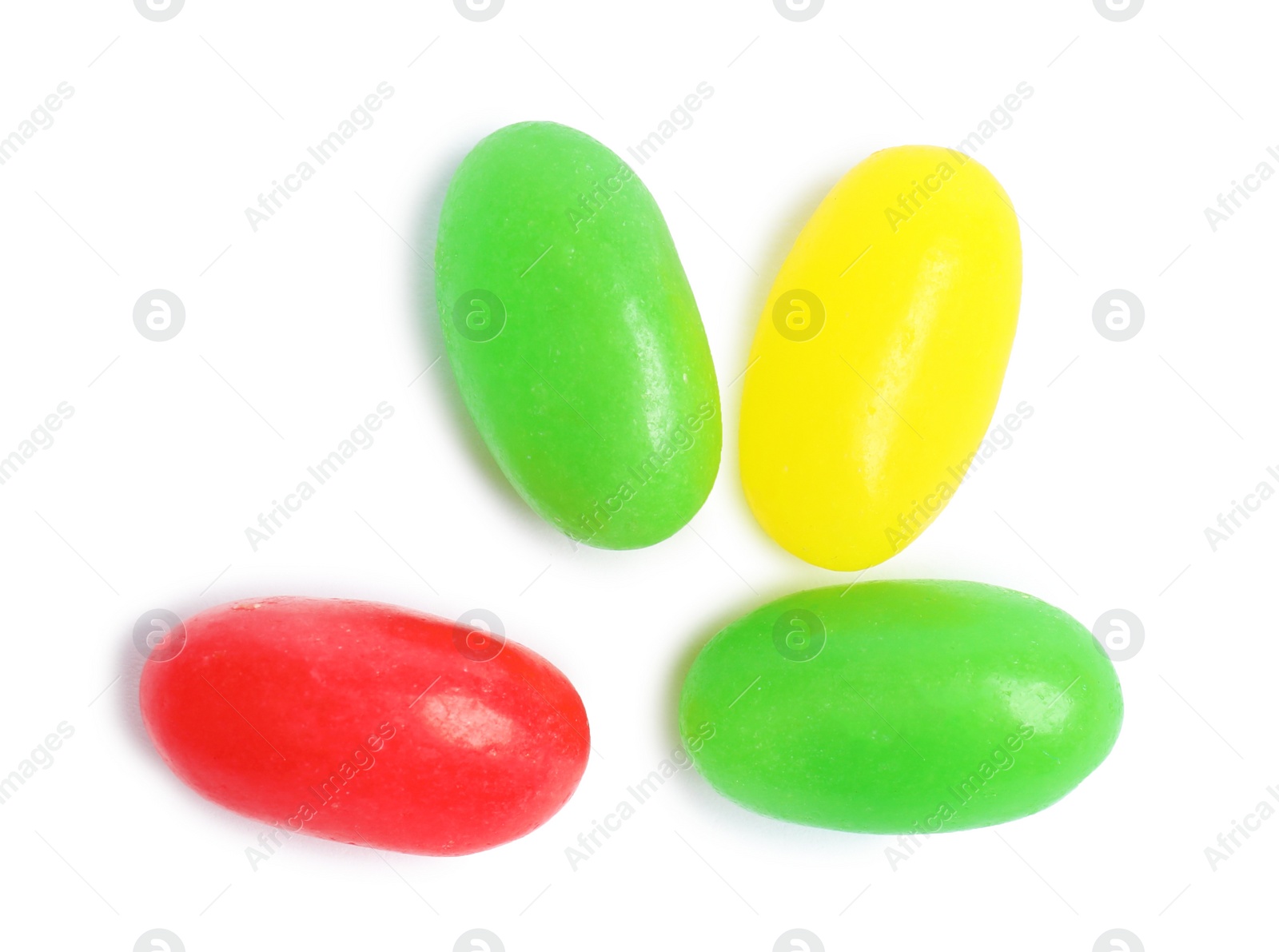 Photo of Delicious colorful jelly beans isolated on white, top view