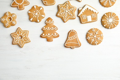 Tasty homemade Christmas cookies on wooden background, top view