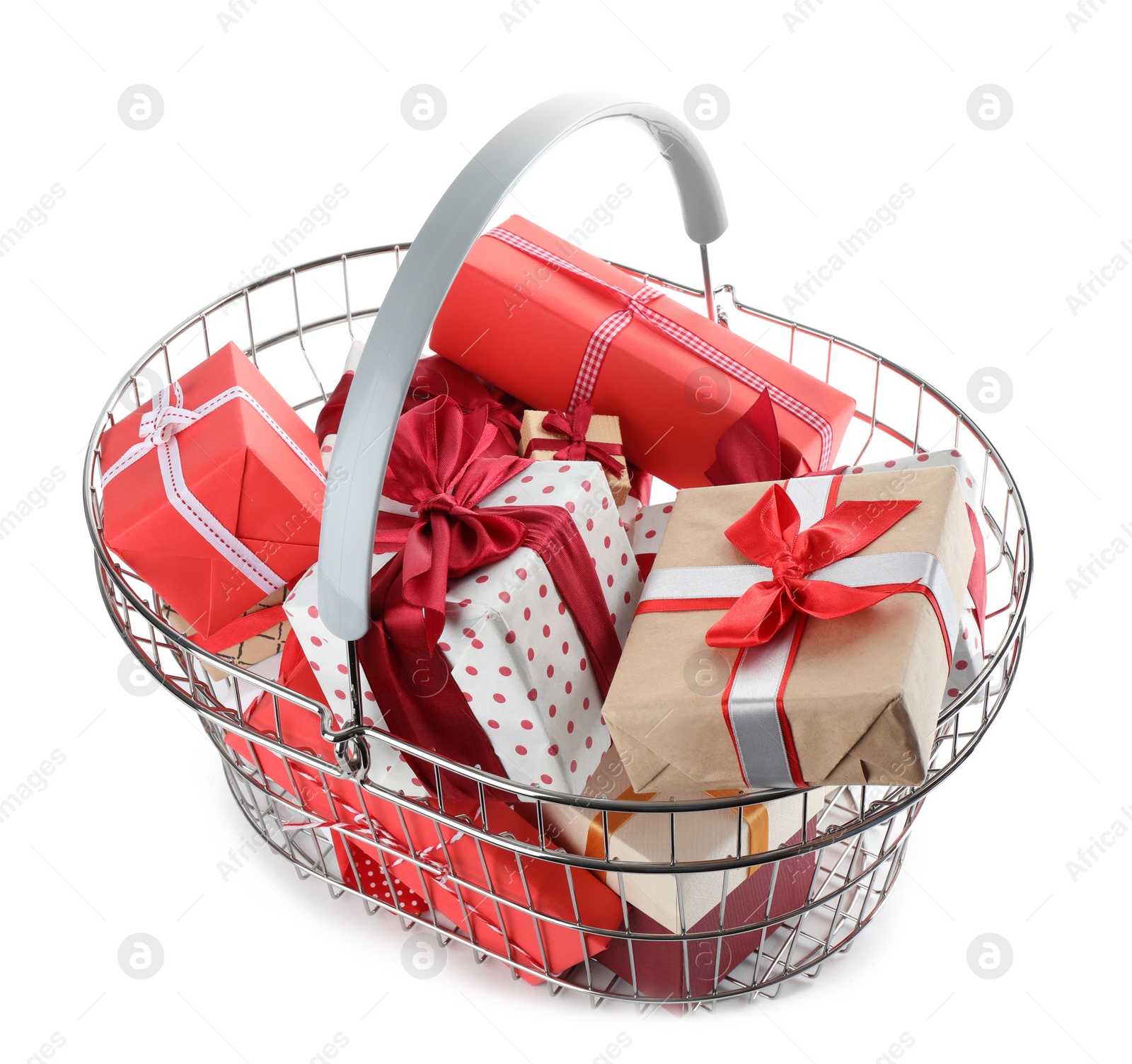 Photo of Shopping basket full of gift boxes on white background