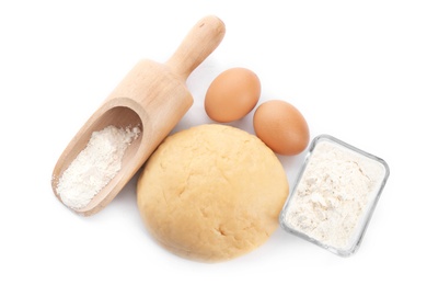 Photo of Composition with fresh raw dough on white background, top view