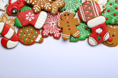 Photo of Different tasty Christmas cookies on white background, flat lay. Space for text