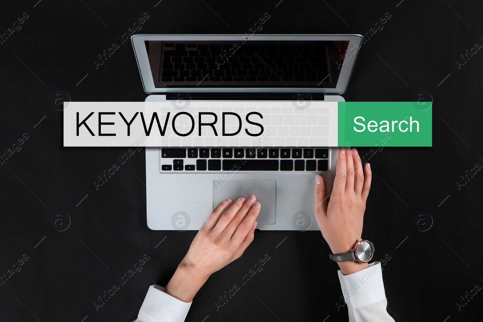 Image of Search bar with text KEYWORDS and woman using laptop on black background, top view