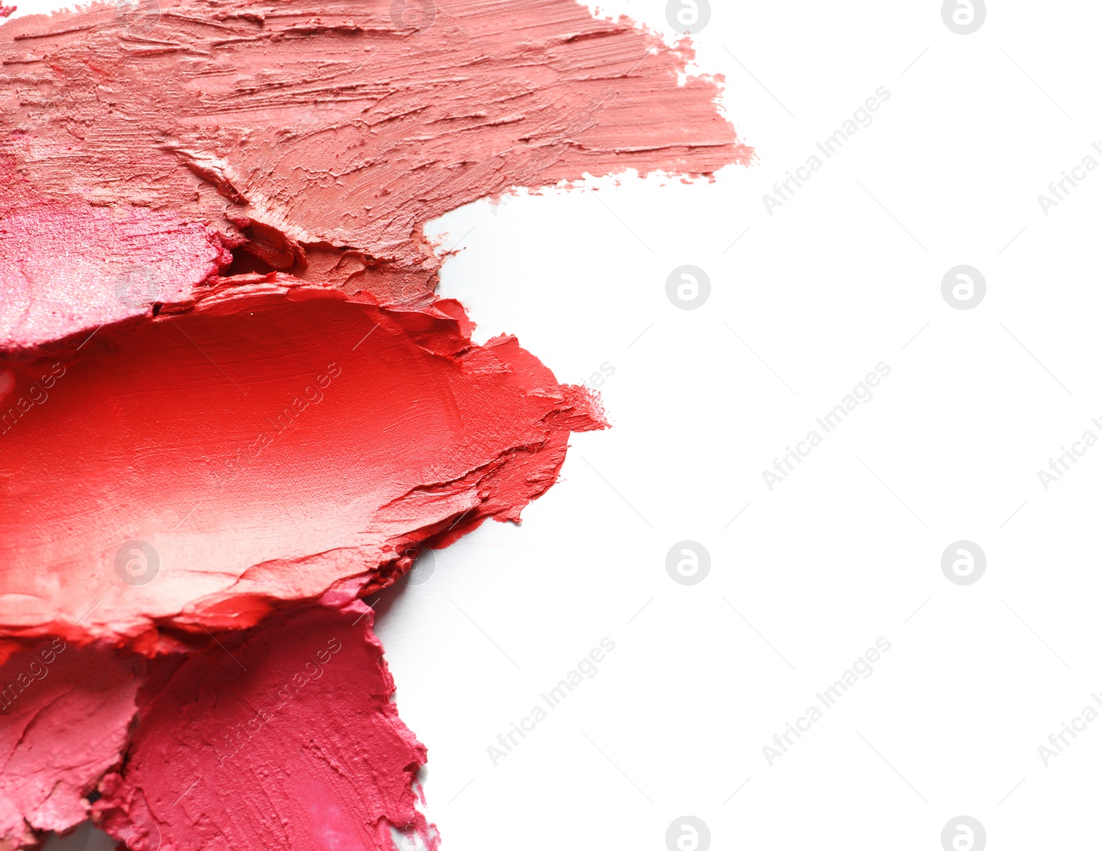 Photo of Collection of lipstick swatches on white background