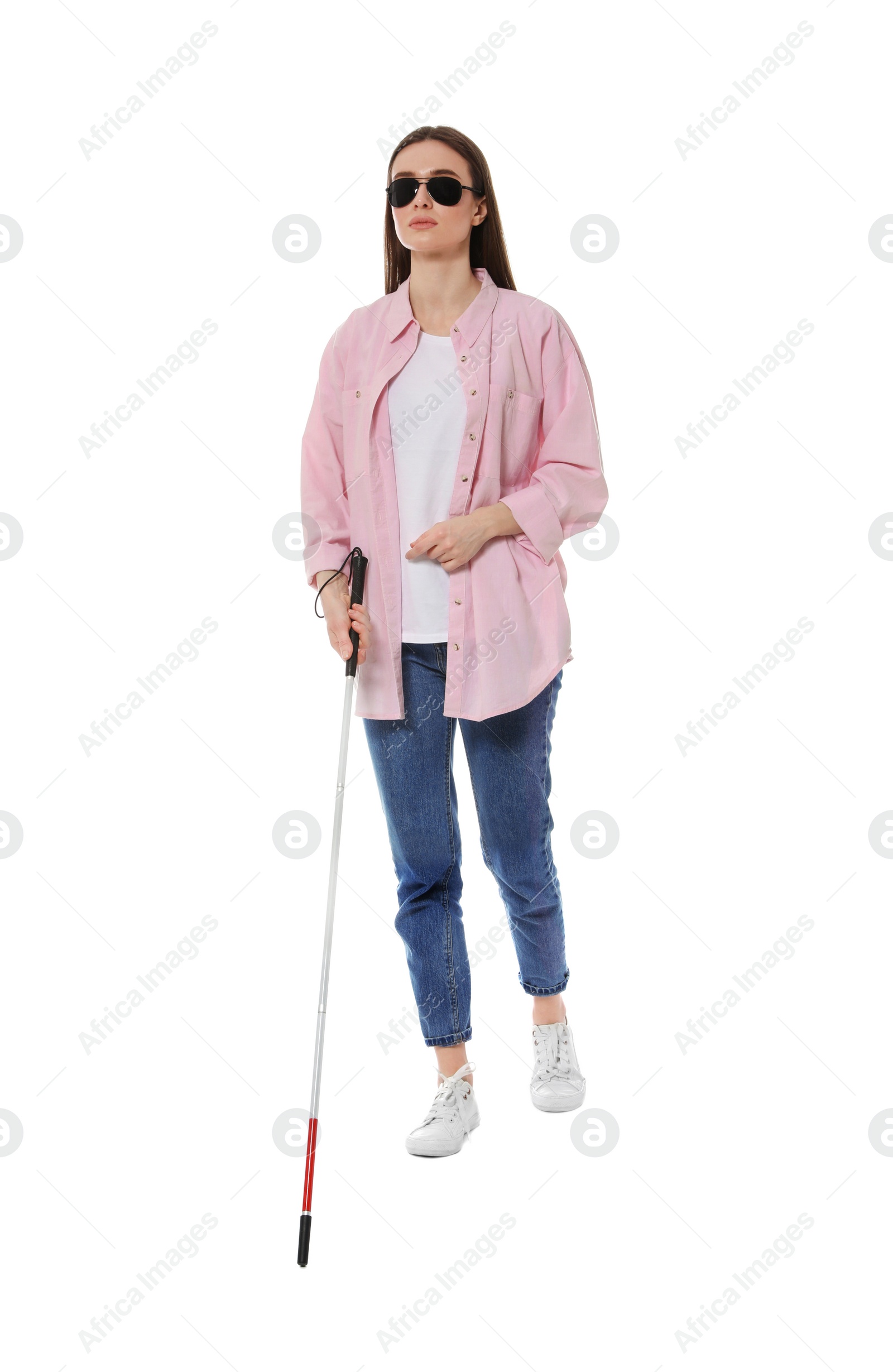 Photo of Blind woman with long cane on white background