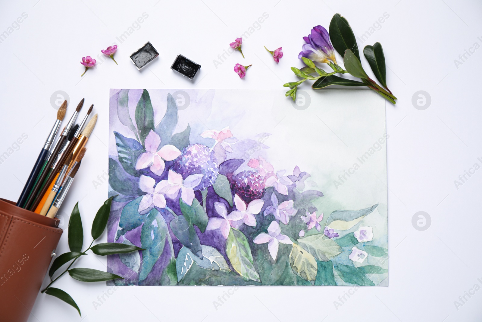 Photo of Flat lay composition with watercolor paints and floral picture on white background