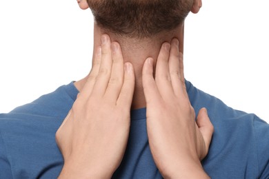 Man suffering from sore throat on white background, closeup