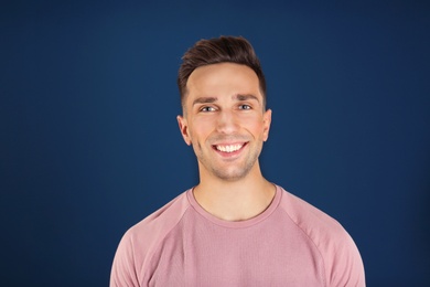 Photo of Portrait of handsome man on color background