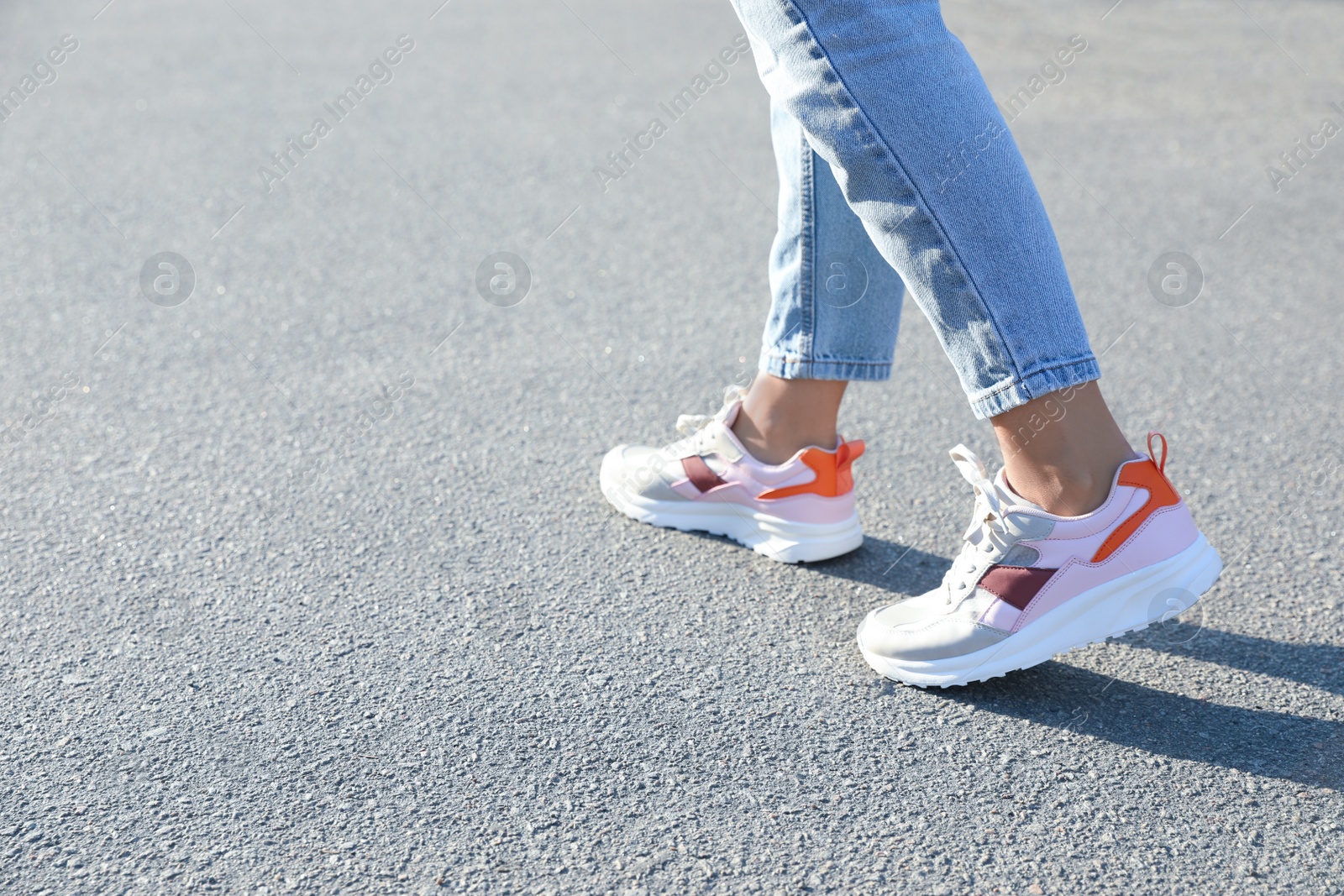 Photo of Woman walking outdoors, closeup with space for text. Choosing way concept.