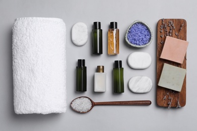 Photo of Flat lay composition with cosmetic products on light grey background