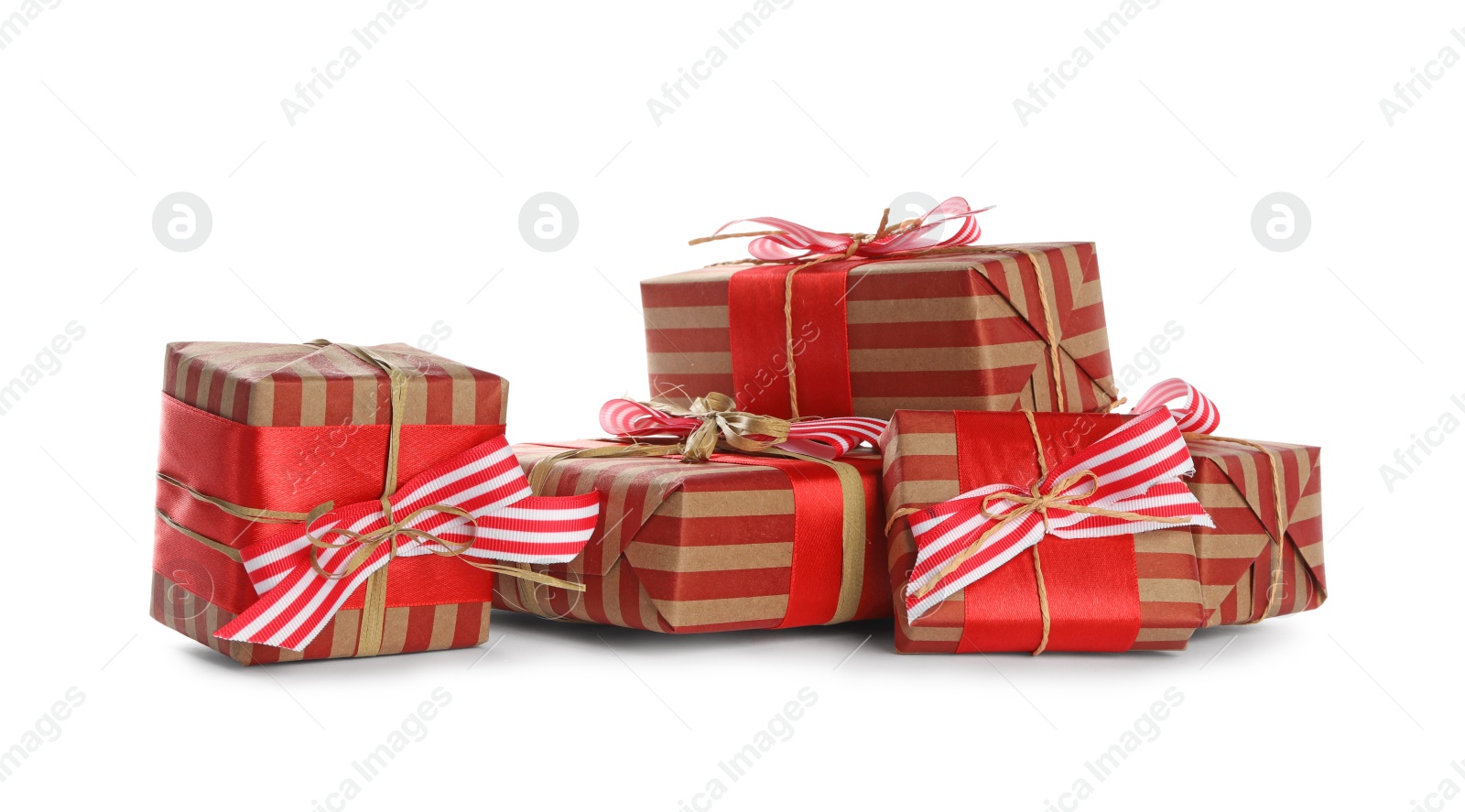 Photo of Christmas gift boxes decorated with bows on white background