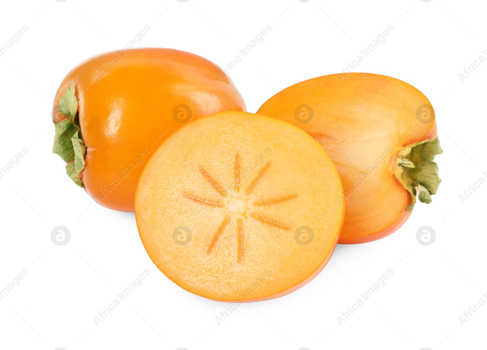 Photo of Whole and cut persimmon fruits isolated on white