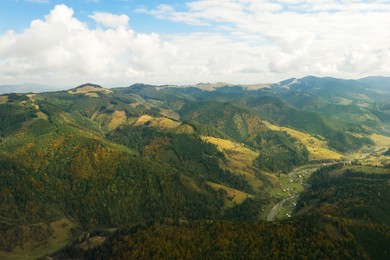 Image of Aerial view of beautiful mountain forest on autumn day