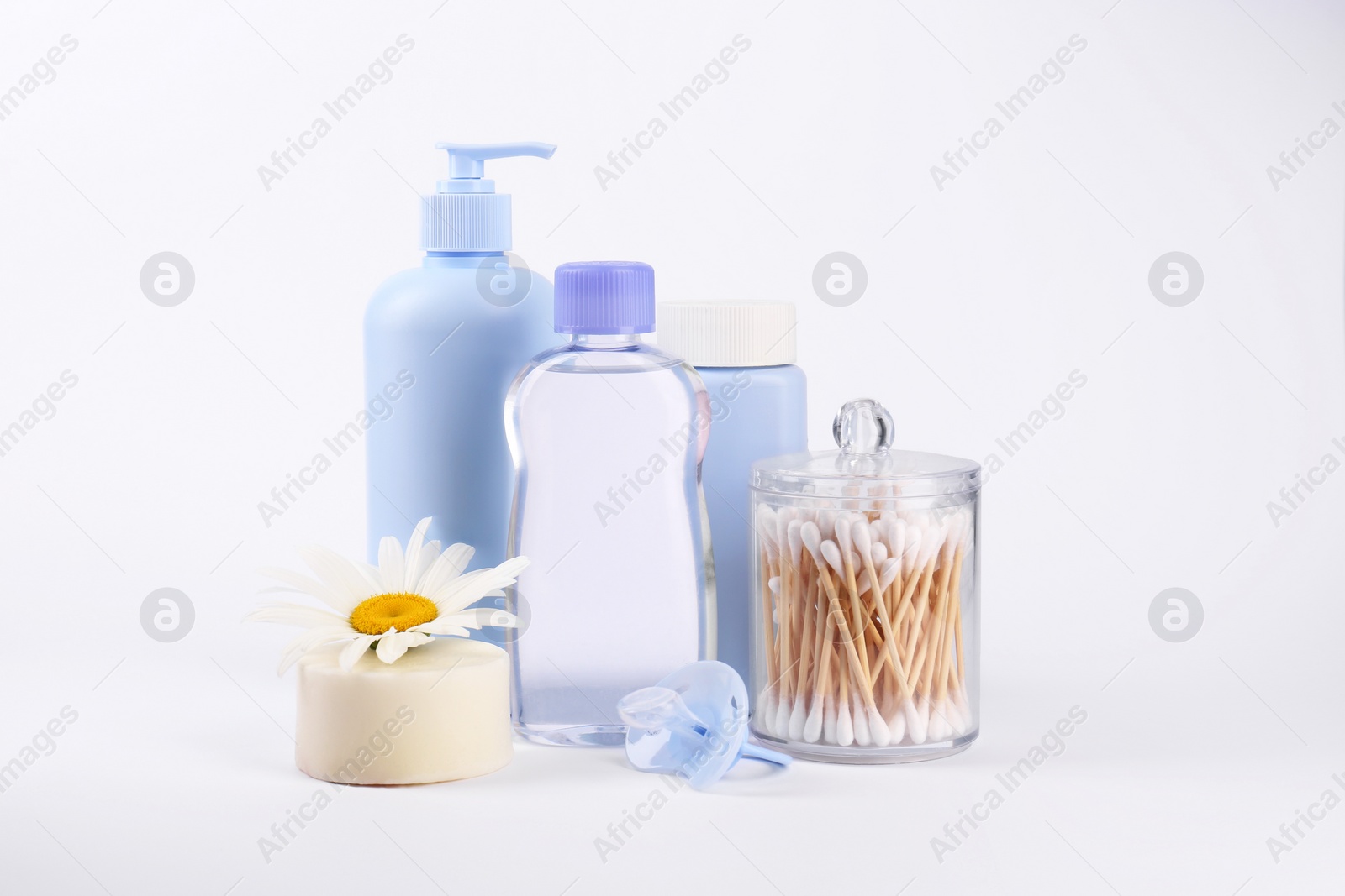 Photo of Different skin care products for baby and pacifier on white background