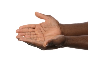 African-American man holding something in hands on white background, closeup