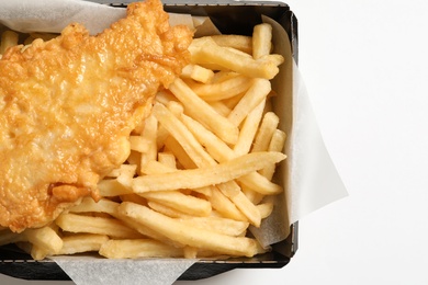 Photo of Disposable container with British Traditional Fish and potato chips on white background, top view