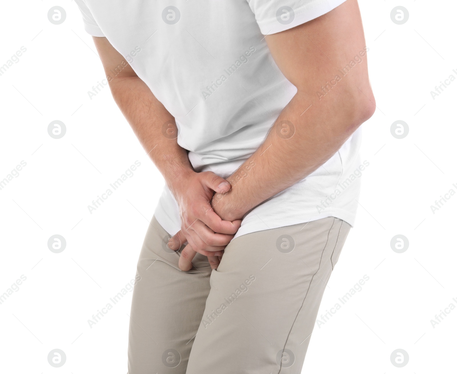 Photo of Young man with urological problems suffering from pain on white background