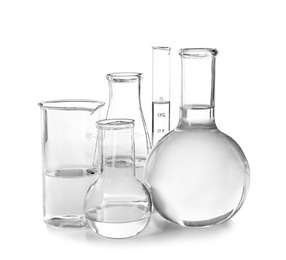 Photo of Flasks with liquid on white background. Laboratory analysis equipment