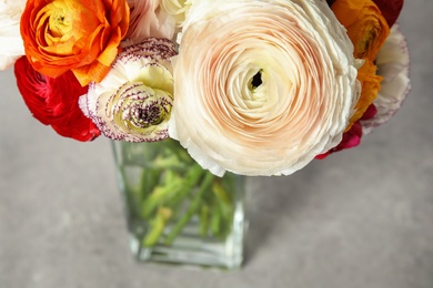 Beautiful spring ranunculus flowers in vase on table