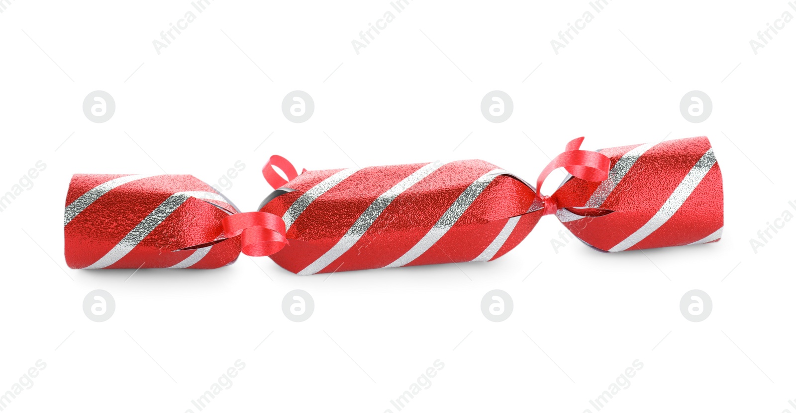 Photo of Bright striped Christmas cracker isolated on white