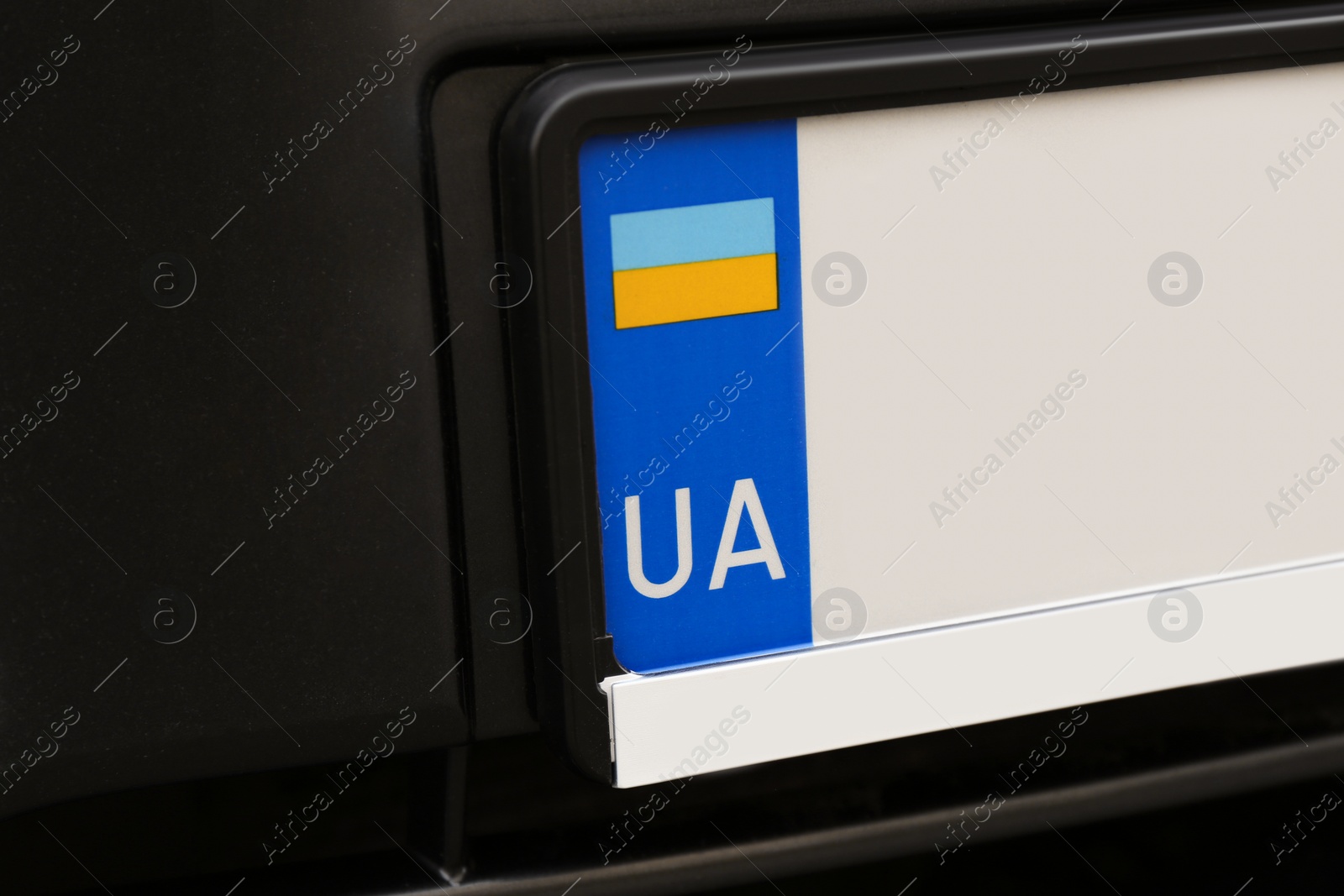 Photo of Car with vehicle registration plate, closeup view