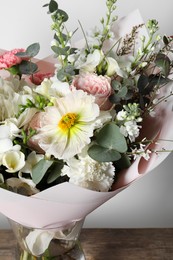 Photo of Bouquet of beautiful flowers in vase on white background, closeup