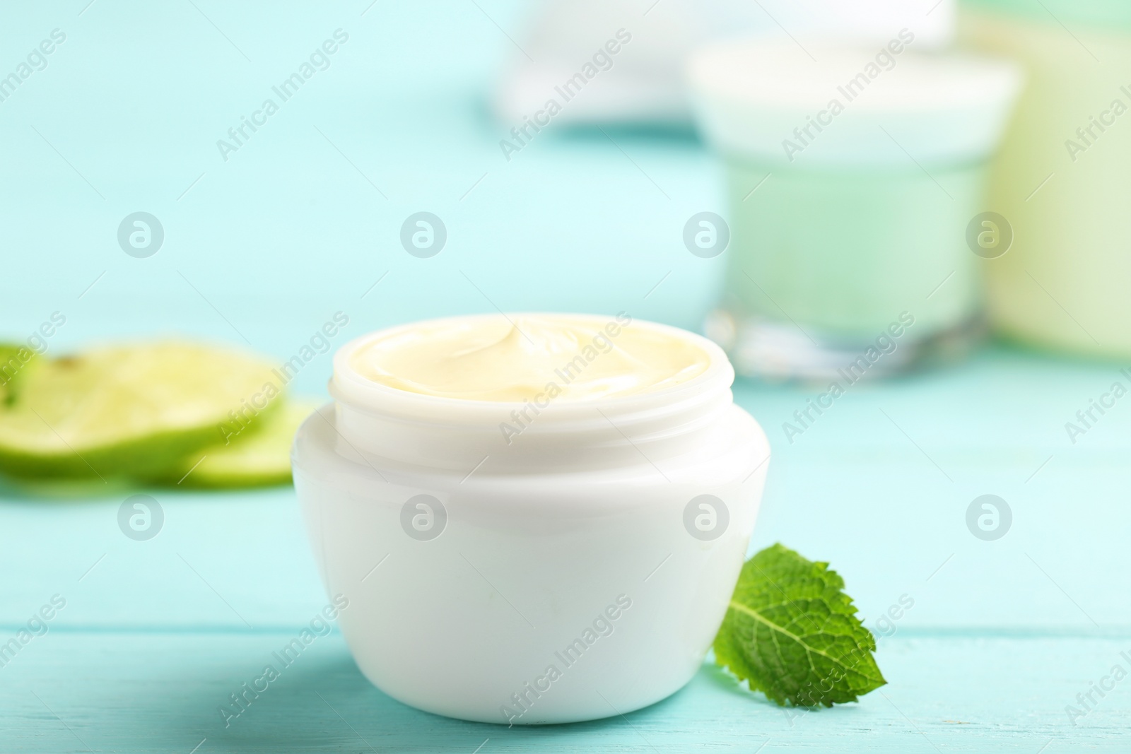 Photo of Jar with cream on wooden background. Hand care cosmetics