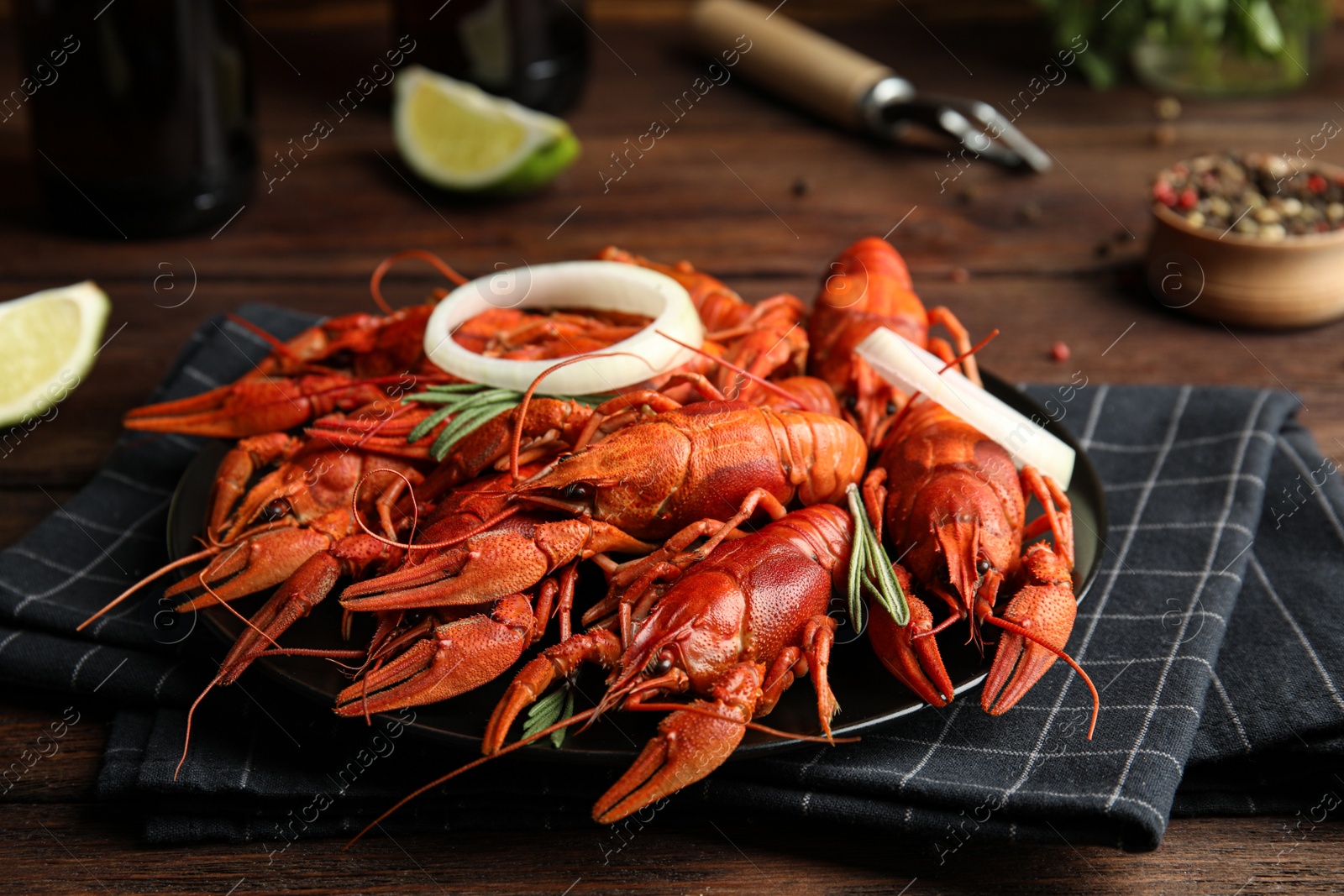 Photo of Delicious red boiled crayfishes on table, closeup