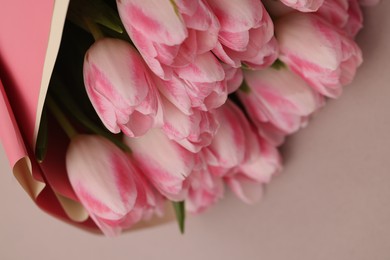 Photo of Beautiful bouquet of fresh pink tulips on light background, closeup