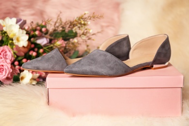 Photo of Stylish female shoes on box