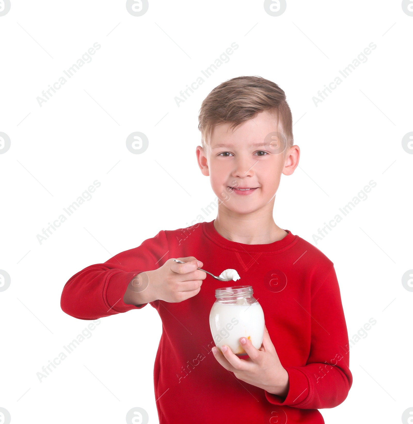 Photo of Little boy with yogurt on white background