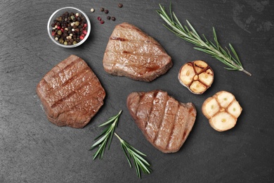 Photo of Flat lay composition with grilled meat on slate plate