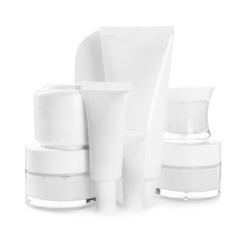 Photo of Blank tubes and jars of cosmetic products on white background