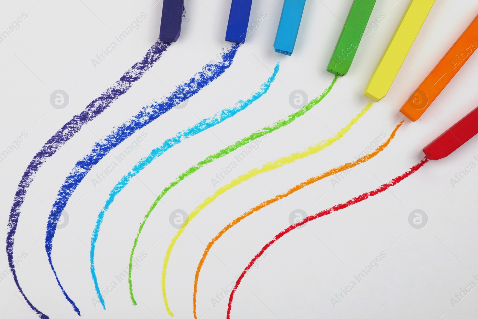 Photo of Colorful pastel chalks and lines on white background, flat lay. Drawing materials