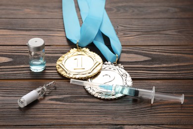 Photo of Composition with drugs on wooden table. Doping control