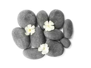 Photo of Spa stones and flowers on white background, top view