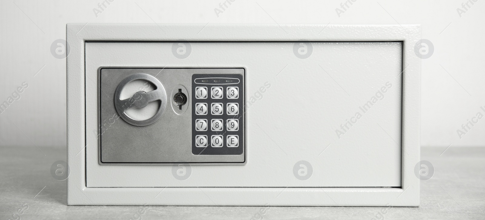 Image of Steel safe with electronic lock on white background, banner design