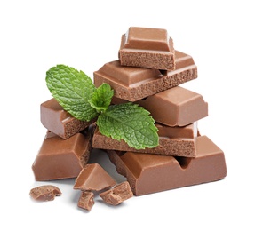 Pieces of milk chocolate with mint on white background