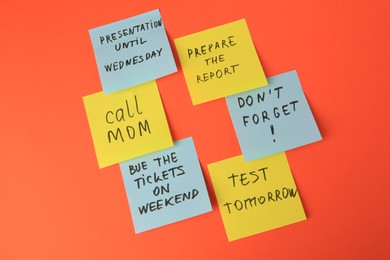 Photo of Many different reminder notes on orange background
