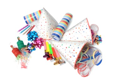 Party crackers and different festive items on white background