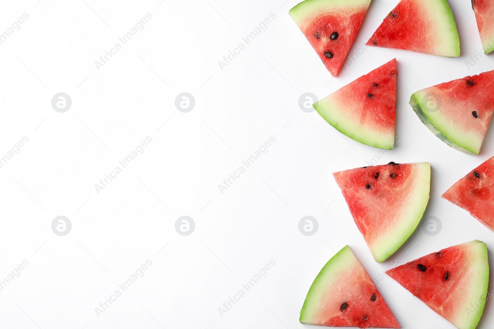 Photo of Slices of ripe watermelon on white background, top view