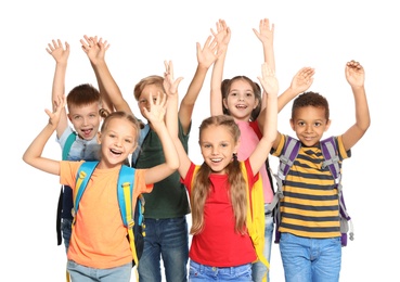 Photo of Group of little school children with backpacks on white background