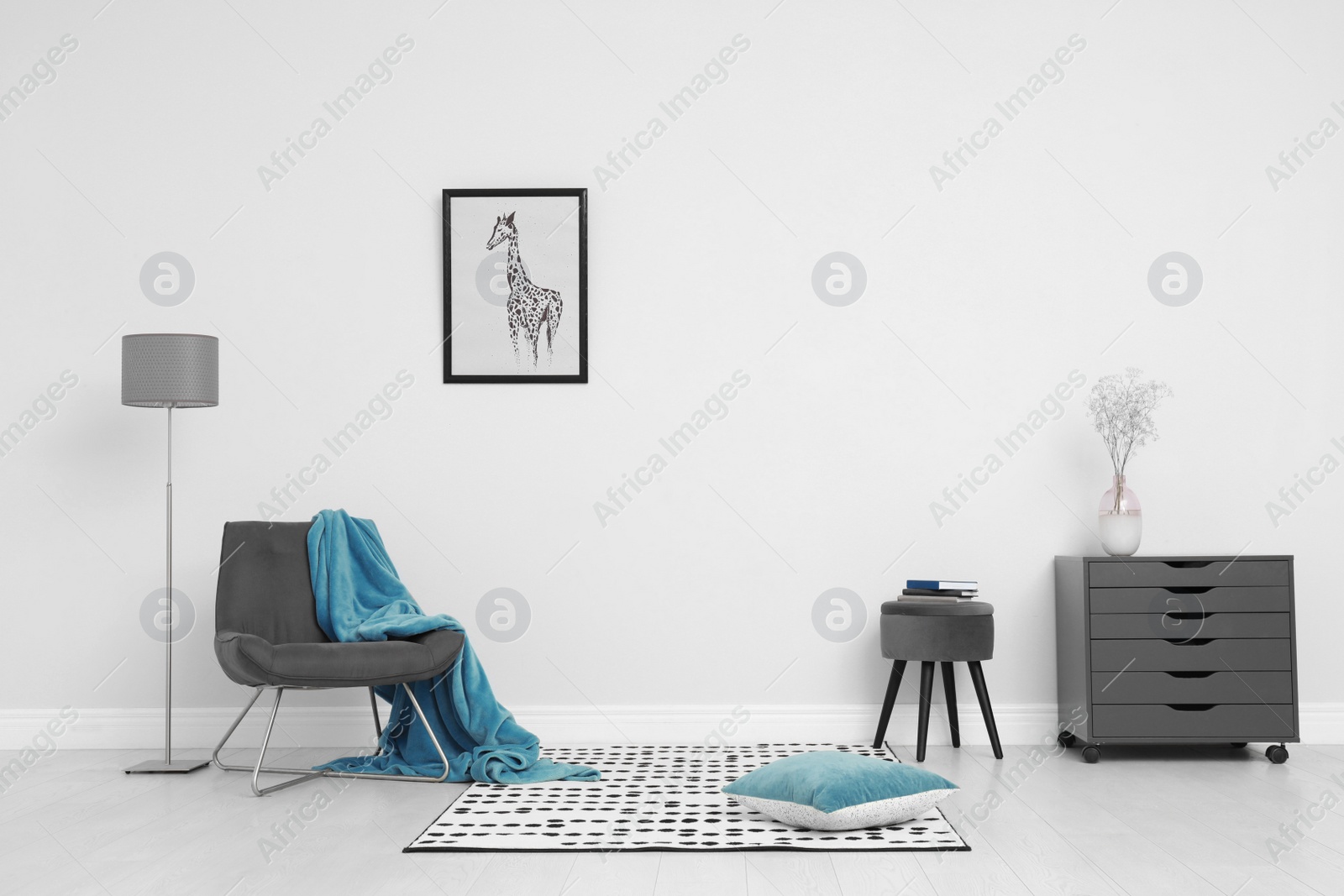 Photo of Room interior with stylish furniture near white wall