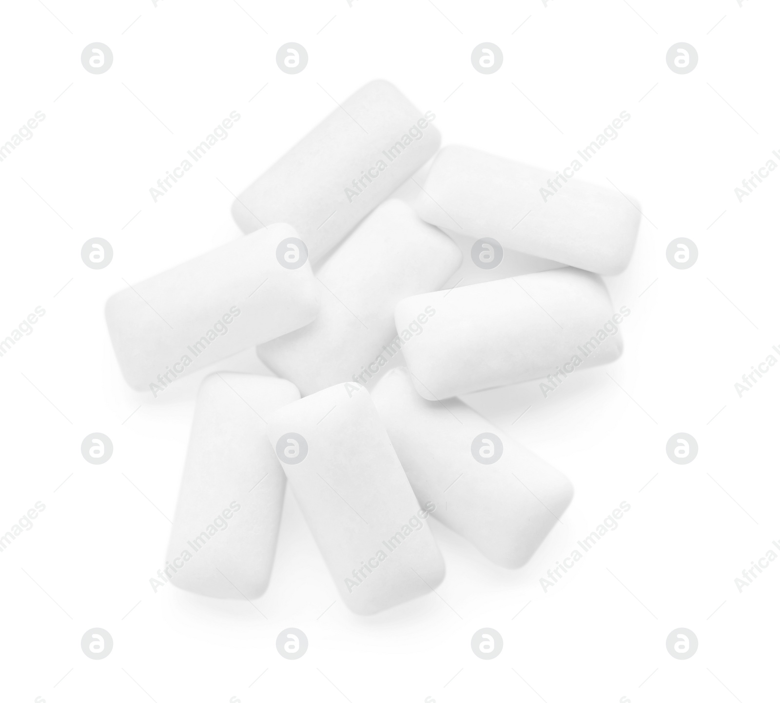 Photo of Heap of chewing gum pieces on white background, top view