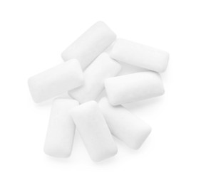 Heap of chewing gum pieces on white background, top view