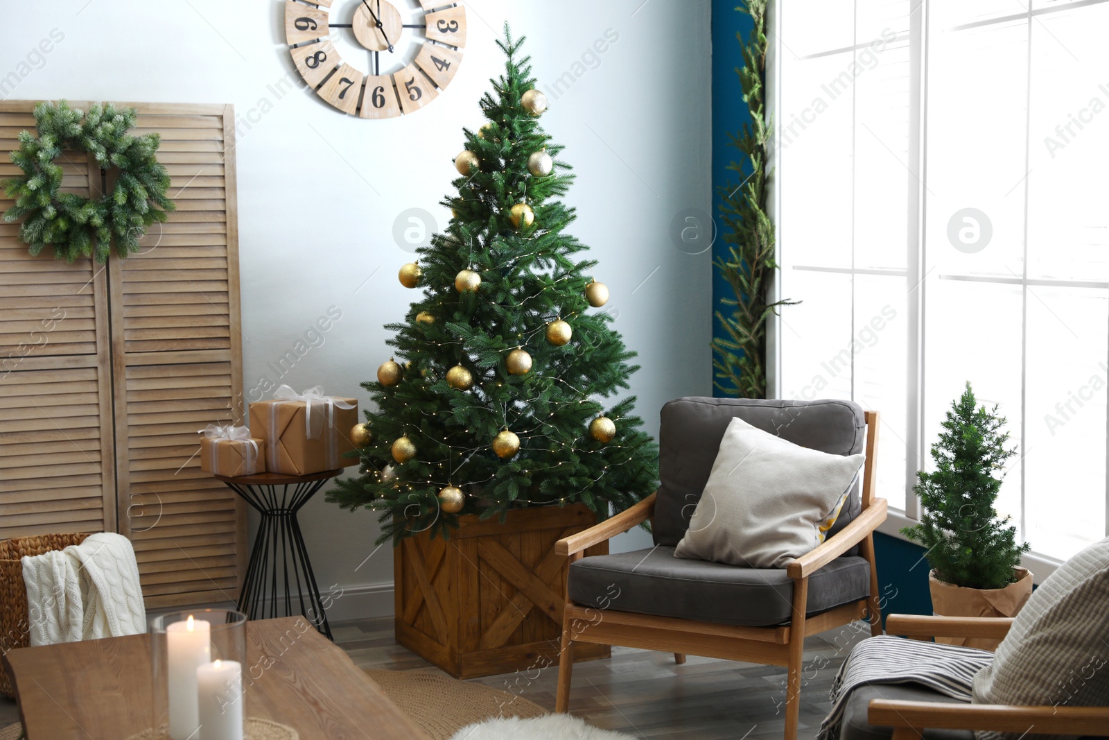 Photo of Beautiful interior with decorated Christmas tree in living room