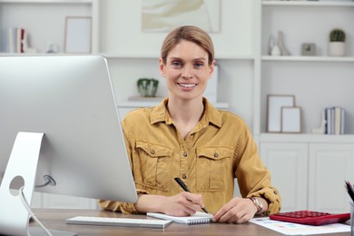 Photo of Professional accountant working at wooden desk in office